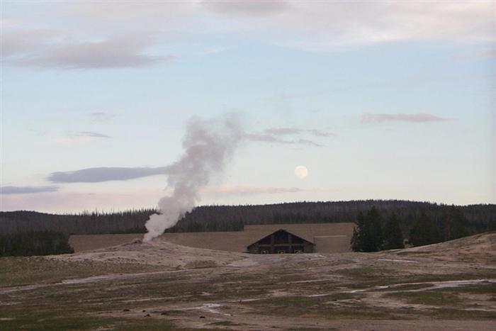 Old Faithful with the Moon in the sky