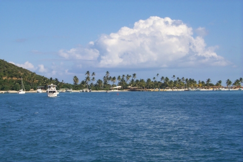A picture of the beach while on a boat tour