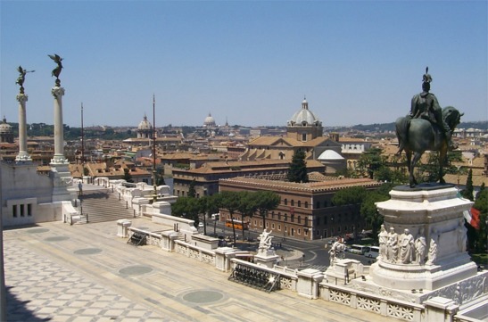 I thought the statues on the monument were really spectacular with their arms stretching out, reaching towards the city.  The dome far off in the photo in the middle of the two other domes is Basilica di San Pietro (Saint Peter's Basilica).