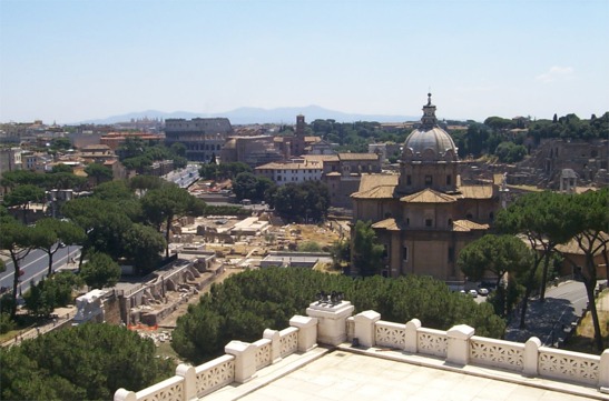 Looking southeast from the monument over the Roman Forum towards the Colosseum.