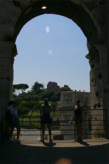 Rachel in one of the arch-ways looking towards the Palentine Hill and the Arch of Constantine.