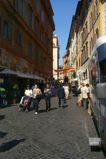A shot down a Roman street next to the Trevi Fountain.