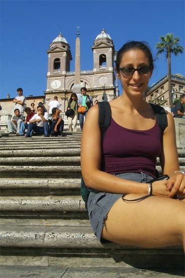 Rachel on the steps.  At the top of the steps is the Church of Trinità dei Monti.