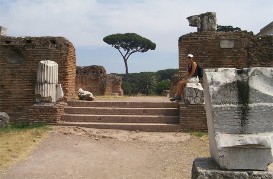 Rachel sitting on a piece of marble that is probably somewhere around 2,000 years old.  The Clivus Palatinus is site of Rome's earliest settlement where, according to legend, Romulus and Remus, the twin sons of Mars, built a city after being encouraged by the gods to build a wall...