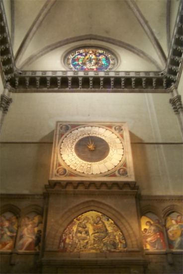 Now inside the church of Santa Maria del Fiori.  The interior of the church is impressive but is stark compared to the church's exterior.  The clock, above the main entrance, is in 24 hour format.