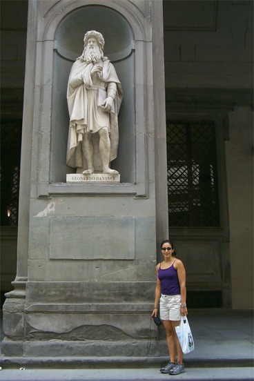 Rachel beneath the statue of Leonardo DaVinci also in front of the Uffizi.