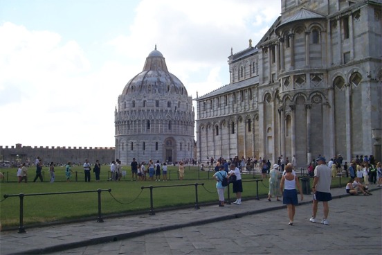 The Bapttistero on the right, Duomo in the middle, and Camposanto the wall in the rear which is a cemetery that supposedly is filled with earth from the Holy Land brought back by returning Crusaders.