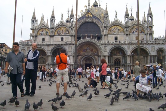 Basilica San Marco, another amazing church, and Piazza San Marco, with an amazing amount of pigeons!  The Basilica was begun in 1063 to house the remains of St. Mark the Evangelist, which were stolen from Alexandria two centuries earlier. ...