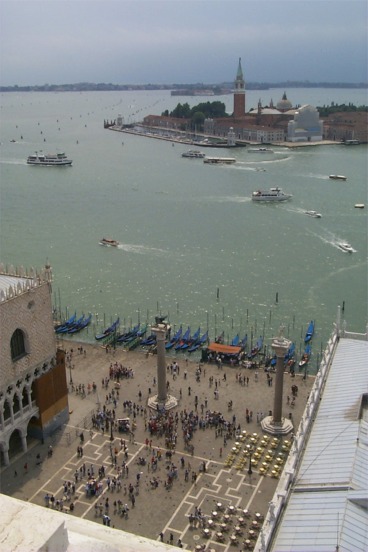 Looking south with the southern edge of Piazza San Marco, and Venice in view.  The adjacent island in view is San Giorgio with the Chiesa di San Giorgio Maggiore, a church that has been on the island since the late 8th century.