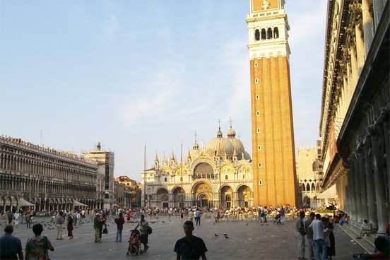 Piazza San Marco appears to be rectangular at first but it actually is wider at the Basilica end, so as to provide the illusion that the church is larger than in reality.  Funny that they do this though as the church is pretty large without the illusion.