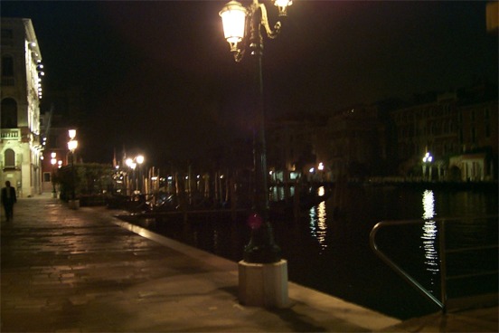 Night time shot of the Grand Canal near the Ponte Rialto