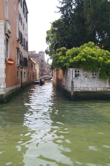 Looking down a smaller canal.  The ride along the Grand Canal was a lot of fun.  You could see the entire goings on of a major city, with the exception of everything being on water. ...