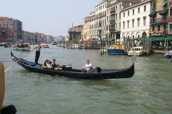 Another amusing activity in Venice is the constant dance of the boats.  Here a gondola hurrying out of the way of the much larger boat. ...
