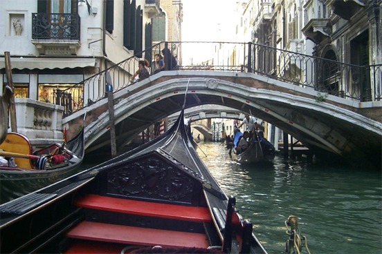 Now you can notice here that the smaller bridges run pretty close to the gondolas.  The gondolier has to duck to go under the bridge.  As I said earlier though the tides are quite high during the winter months which means that the gondolas stop running. ...