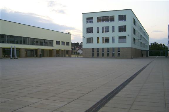 Lots of concrete and not much brick.  Very dissimilar to universities in the US.