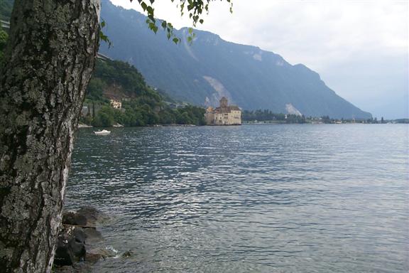 Castle of Chillon in the distance with the Alps towering in the background.