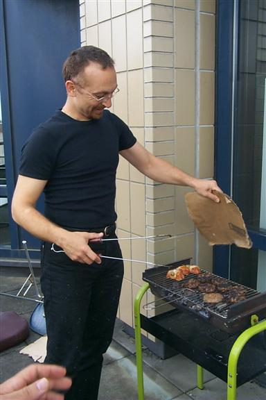 Here he is seen airing the meats, which really didn't make much sense to me as the wind was really blowing here and forced us to eat inside.