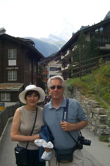 Zermatt for those that don't know is the town below the Matterhorn.  Seen here behind the parents but you probably have to squint to see it.  It is quite faint due to the sun.