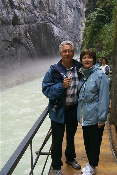 It was raining this day and the water was really rushing.  A cool fog can be seen above the water.  Here my mom and dad pose for a shot.
