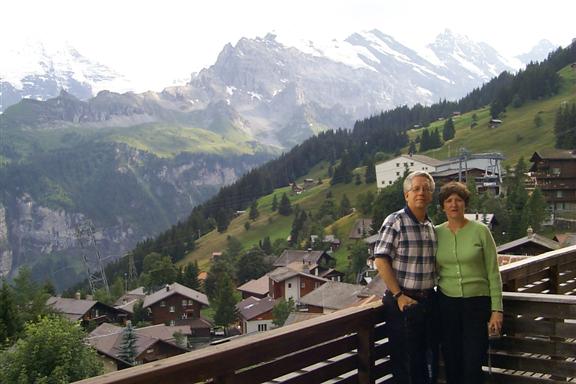 Mom and dad on the balcony of the hotel room.  The cable car stop is directly behind their heads.