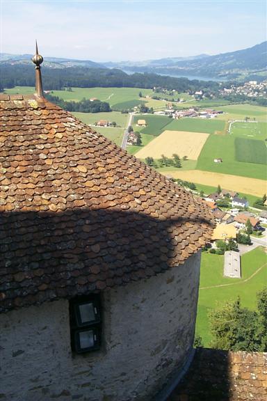 View of side of church and valley below.