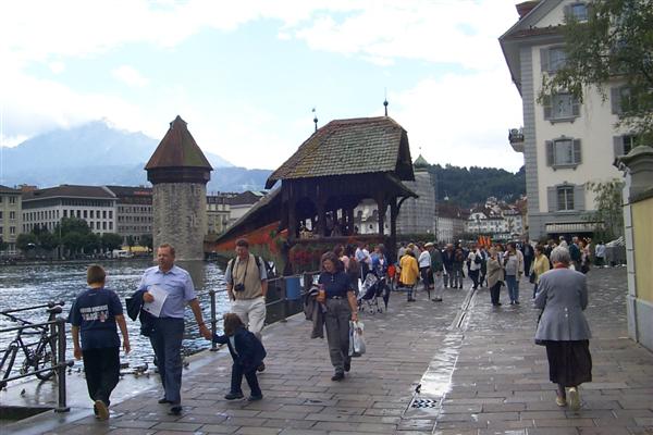 Kapellbrücke from the other side.  In 1993 80% of the bridge burned in a fire, along with it went the original painted gables.  Today, though, the bridge is nearly fully restored with the paintings faithfully reproduced from lithographes.