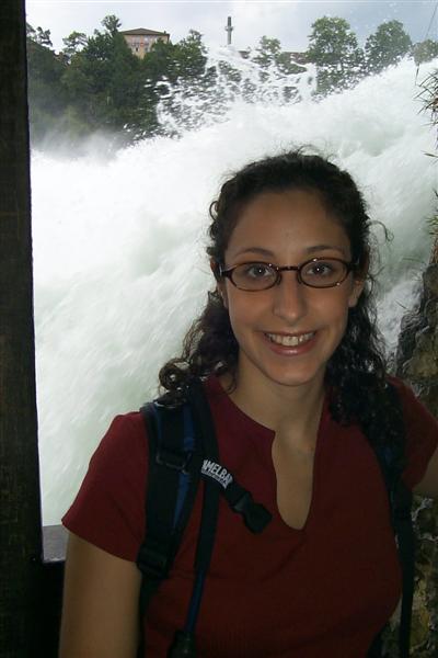 Rachel in a small tunnel built alongside the falls.