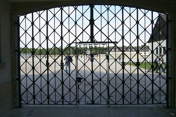 "Arbeit Macht Frei", German for Work Frees.  Kind of a sick paradox, Dachau was a forced labor camp.