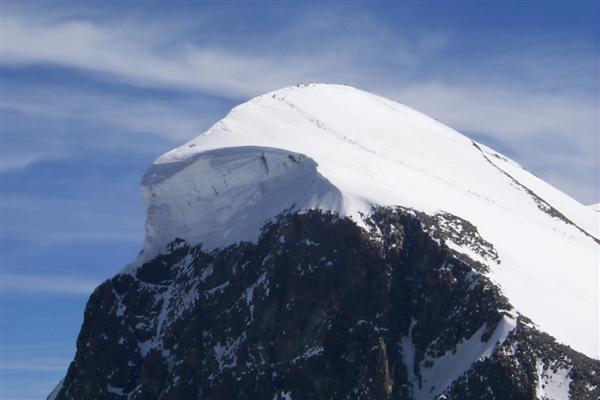 For this trip though you rise from Zermatt at 5,300 ft to the Klein Matterhorn at 12,200 ft in about 20 minutes and you can really feel the lack of oxygen when walking.  Here a close-up of the Breithorn.  The faint line closest to the face of the peak is a line of people that are ascending the mountain.  This should put the size of things into perspective.