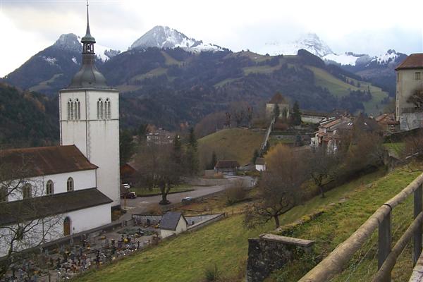 Gruyère, the church, and the Alps.