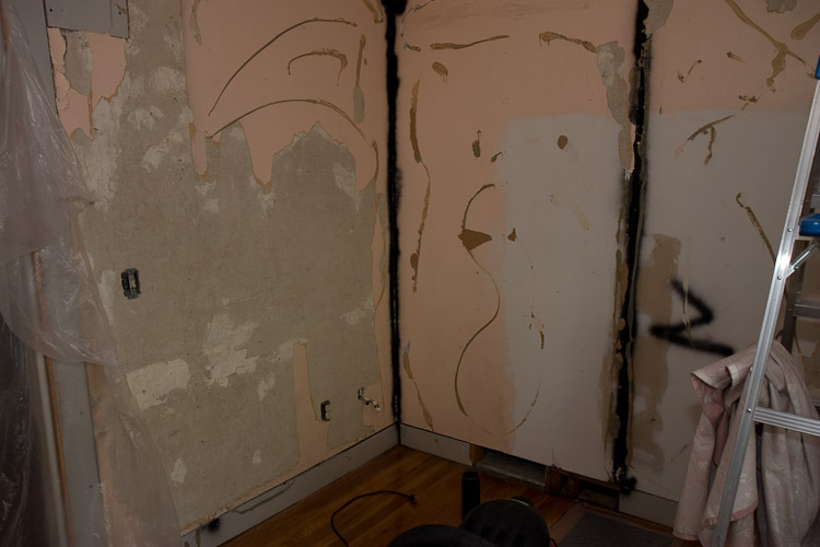 ... and beneath the paneling, the original plaster walls