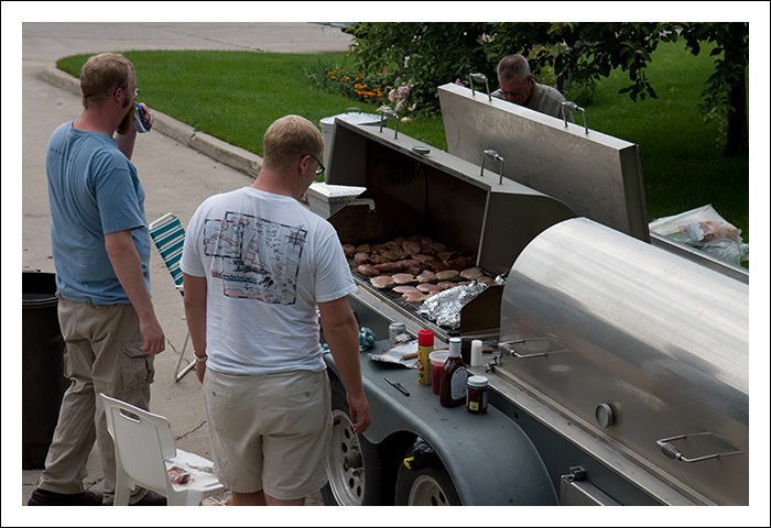 The grill... A fantastic achievement of mankind... this giant grill is a portable trailer equipped with two grilling surfaces and two coolers