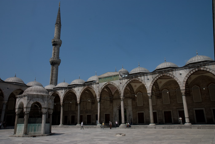 The courtyard... To enter the mosque women are requested to wear a head scarf and everyone has to take off their shoes.  They provide plastic bags to carry your shoes.  I'm not sure if all mosques are like this, but I'm guessing it might be unique to Turkey, amusingly the entire interior floor of the mosque is covered in nice Turkish rugs.